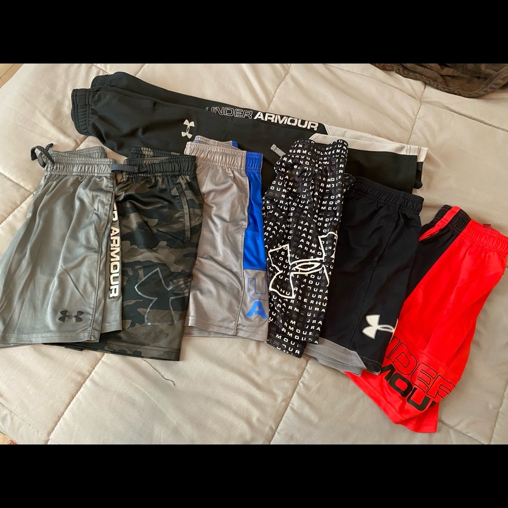 6 UA shorts and 1 pair of UA pants.